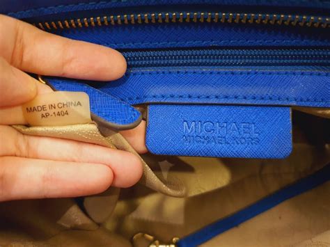 how to tell if my michael kors bag is real|michael kors serial number checker.